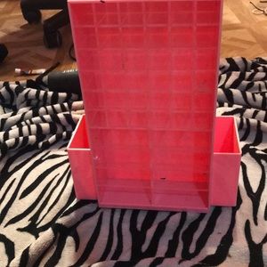 Rotating lipstick and brush holder